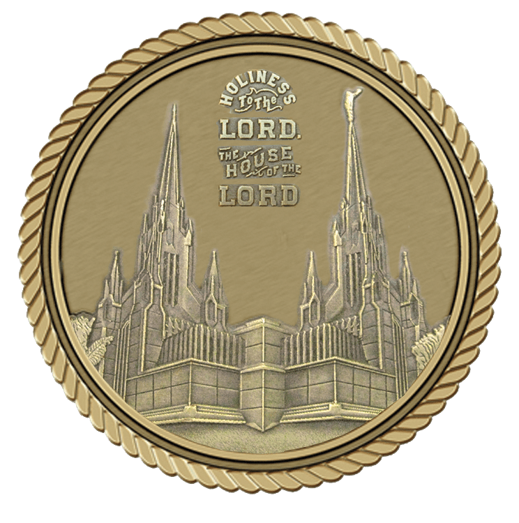A gold medal with the image of an old church.
