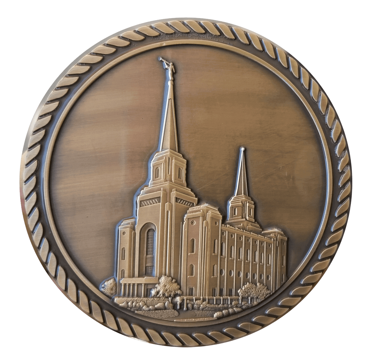 A bronze medal with the image of an lds temple.