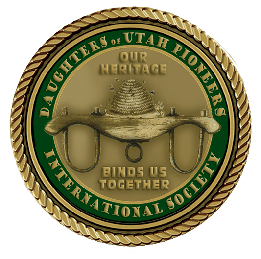 A gold colored medal with the words daughters of utah pioneers international society in it.